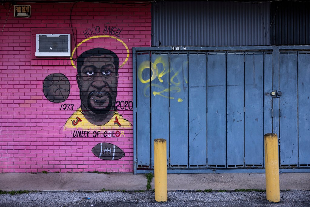 A George Floyd mural is painted on the wall of a closed grocery store across from Cuney Homes in Houston's Third Ward.