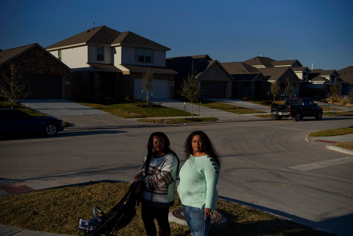 Teressa Tolon, 24, and her mother, Nakisha Platt, 47, take a walk through the neighborhood where Platt recently purchased a home with the help of the Community Land Trust