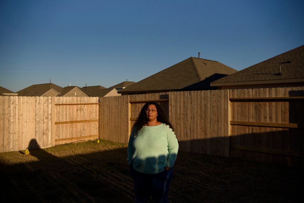 Nakisha Platt, 47, poses for a portrait at her home