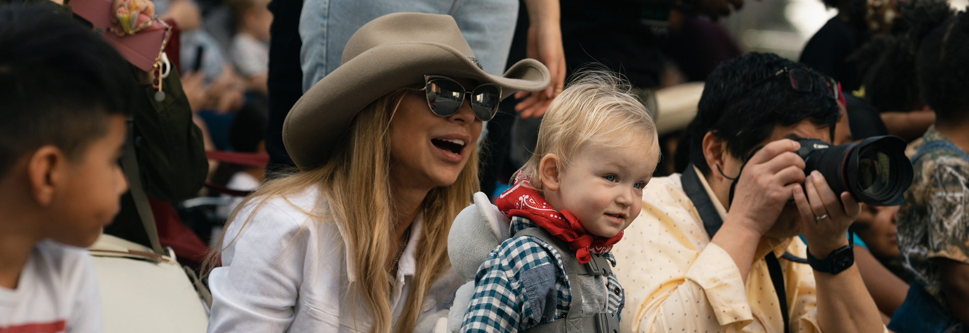 Mother and child watch the rodeo parade