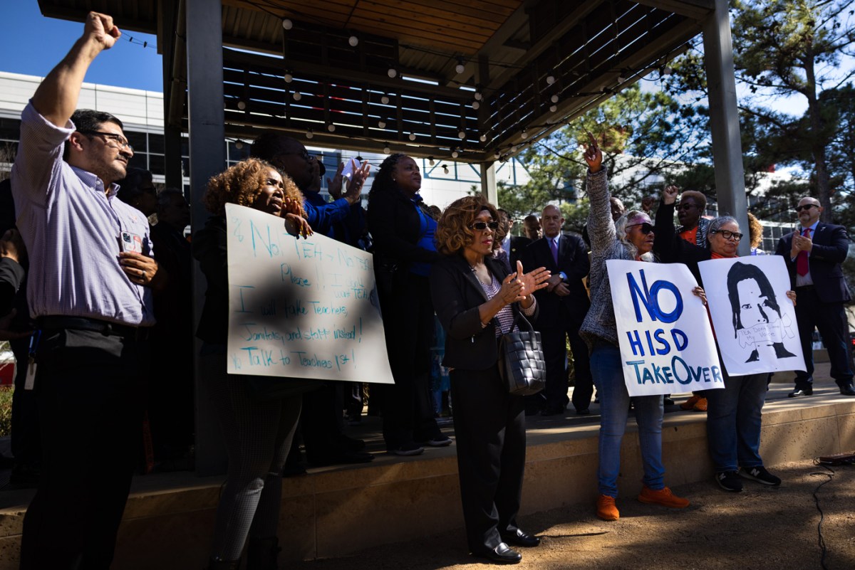 Teachers protest at a rally