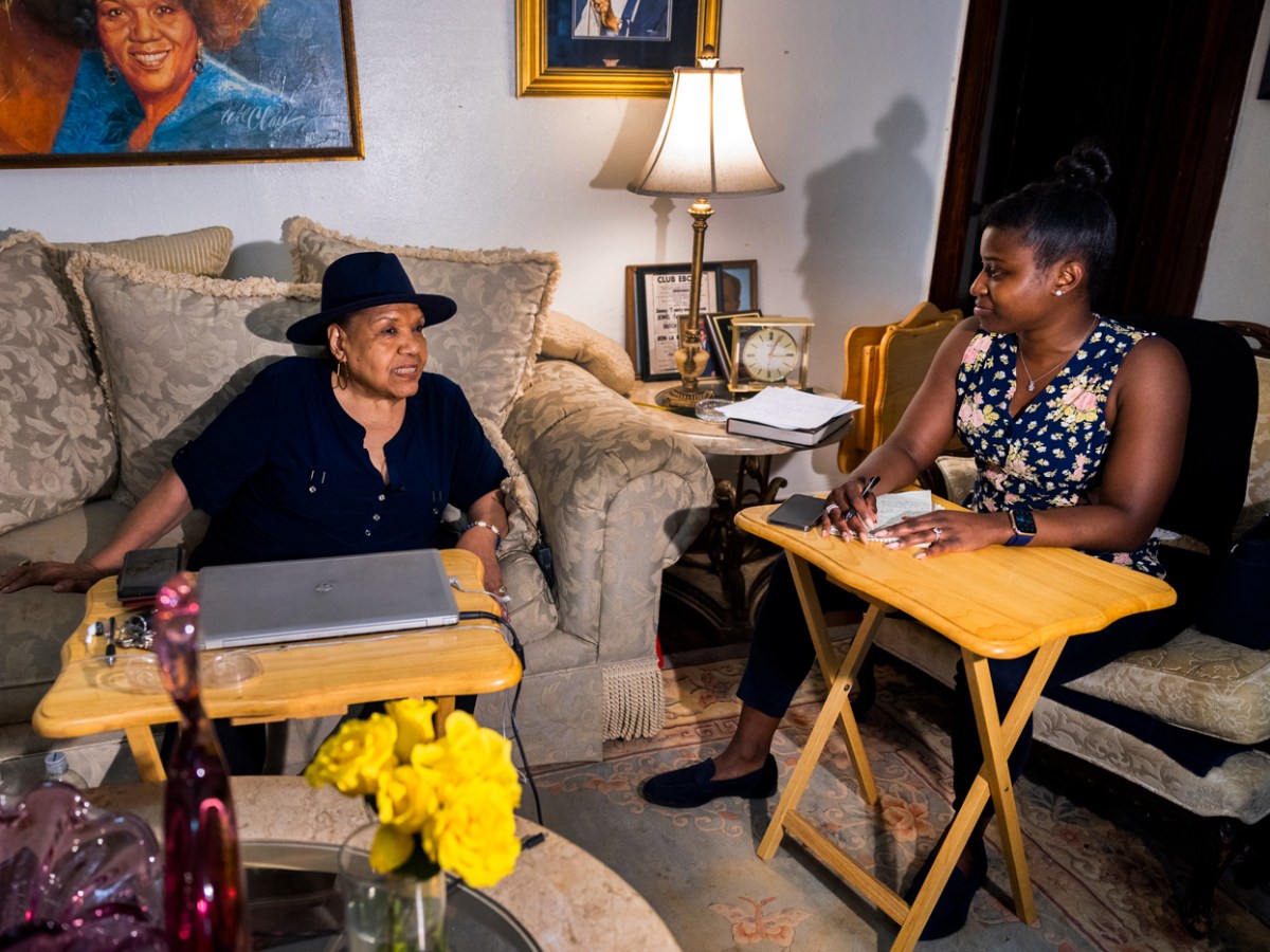 Monique Welch interviews a woman for the Houston Landing.