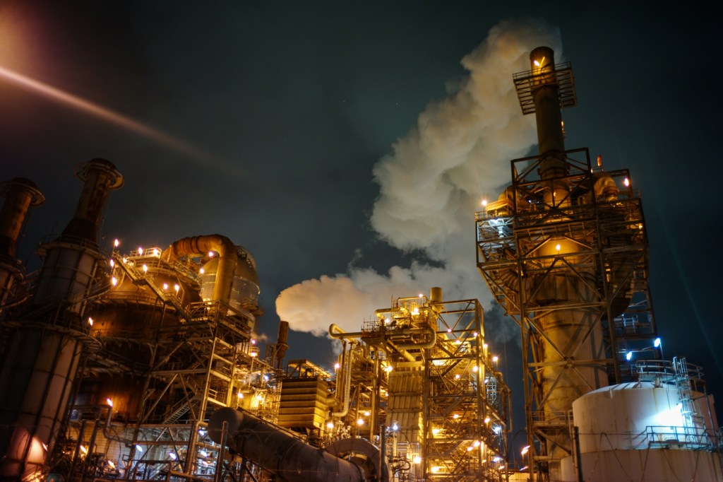 A billow of steam rises from a refinery in Pasadena