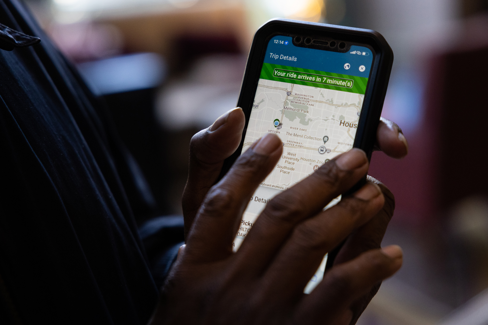 George Battiste, METROLift paratransit user, checks the status of his ride back home after attending a work conference at the Hilton Houston Post Oak by the Galleria