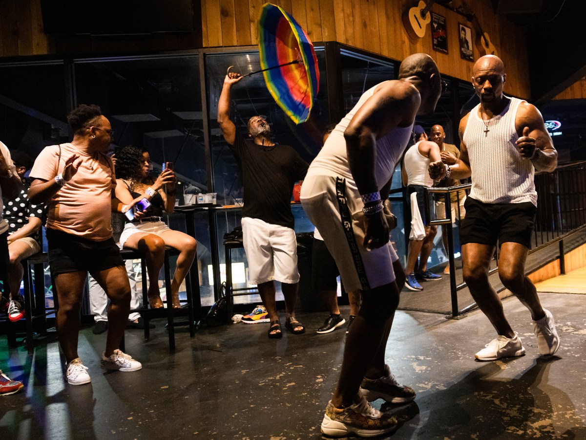 People dance during an LGBTQ event