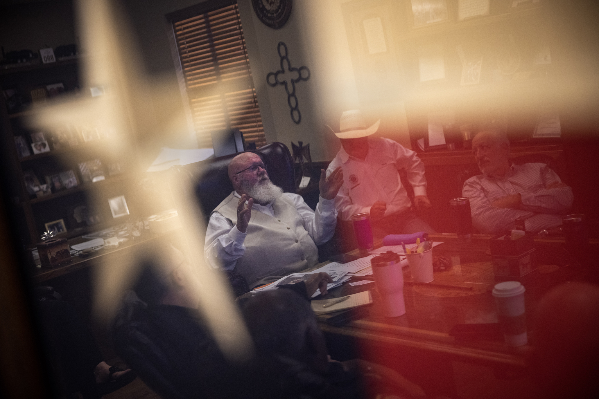 Reflection of a man through Texas flag