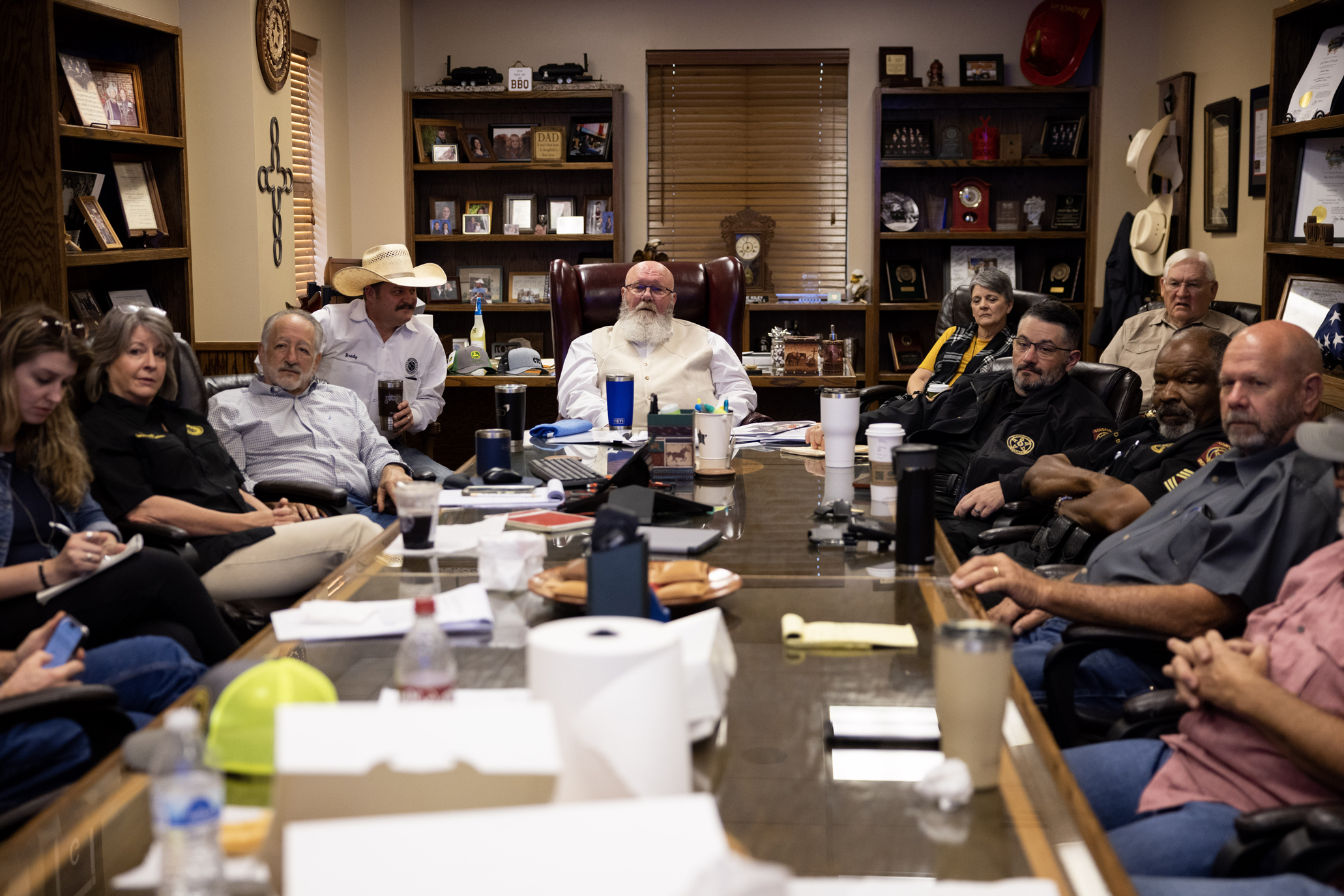 A group of people attend a meeting