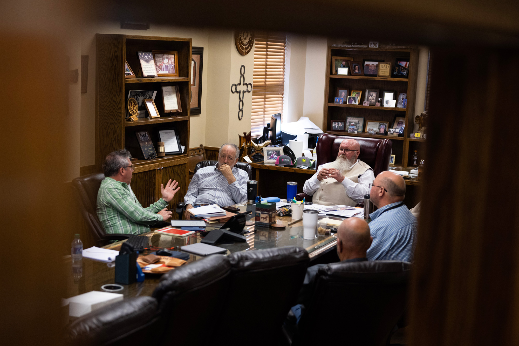 Commissioner Charlie Riley, at center right, along with his staff, participate in a planning meeting with Shane Howard to discuss planning for a new park.