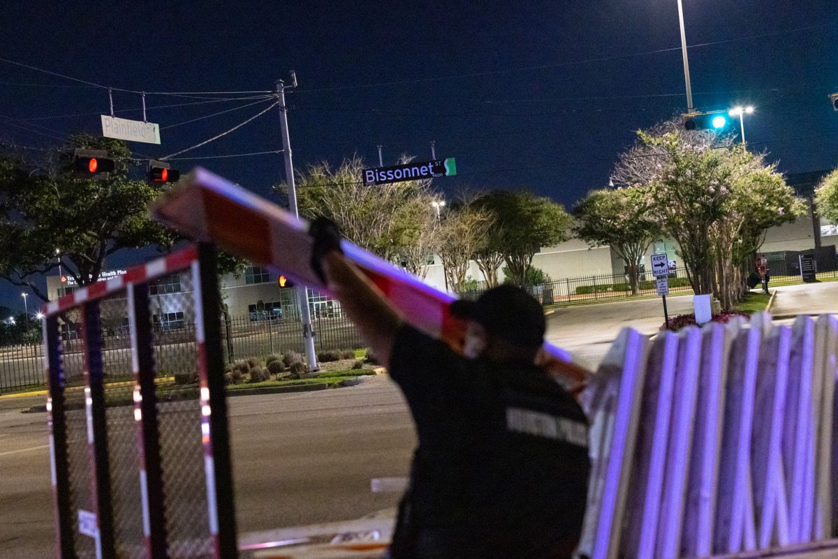 A police officer places barricades