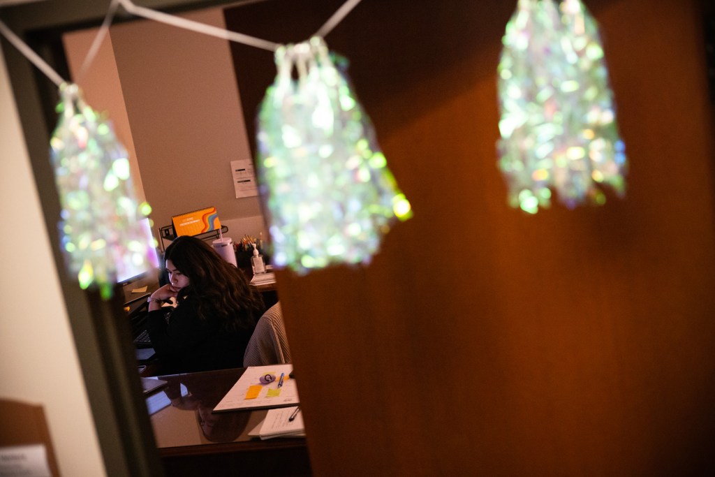 Nidia Ventura looks over cases from the previous night to prepare for a morning and afternoon at court at the Harris County Criminal Justice Center