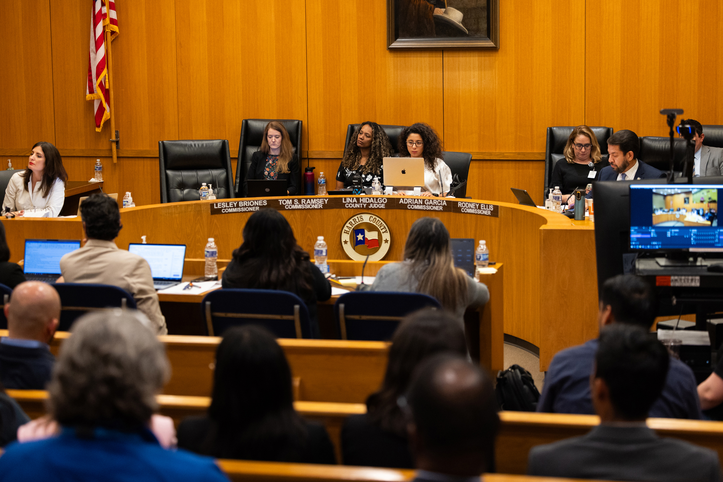 Harris County Commissioner Lesley Briones, Harris County Judge Lina Hidalgo and Commissioner Adrian Garcia attend a Harris County Commissioners Court meeting in Houston.
