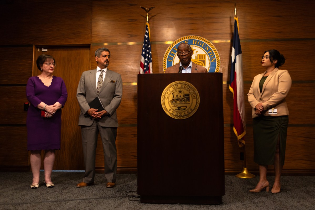 Houston Mayor Sylvester Turner, center, talks to members of the press