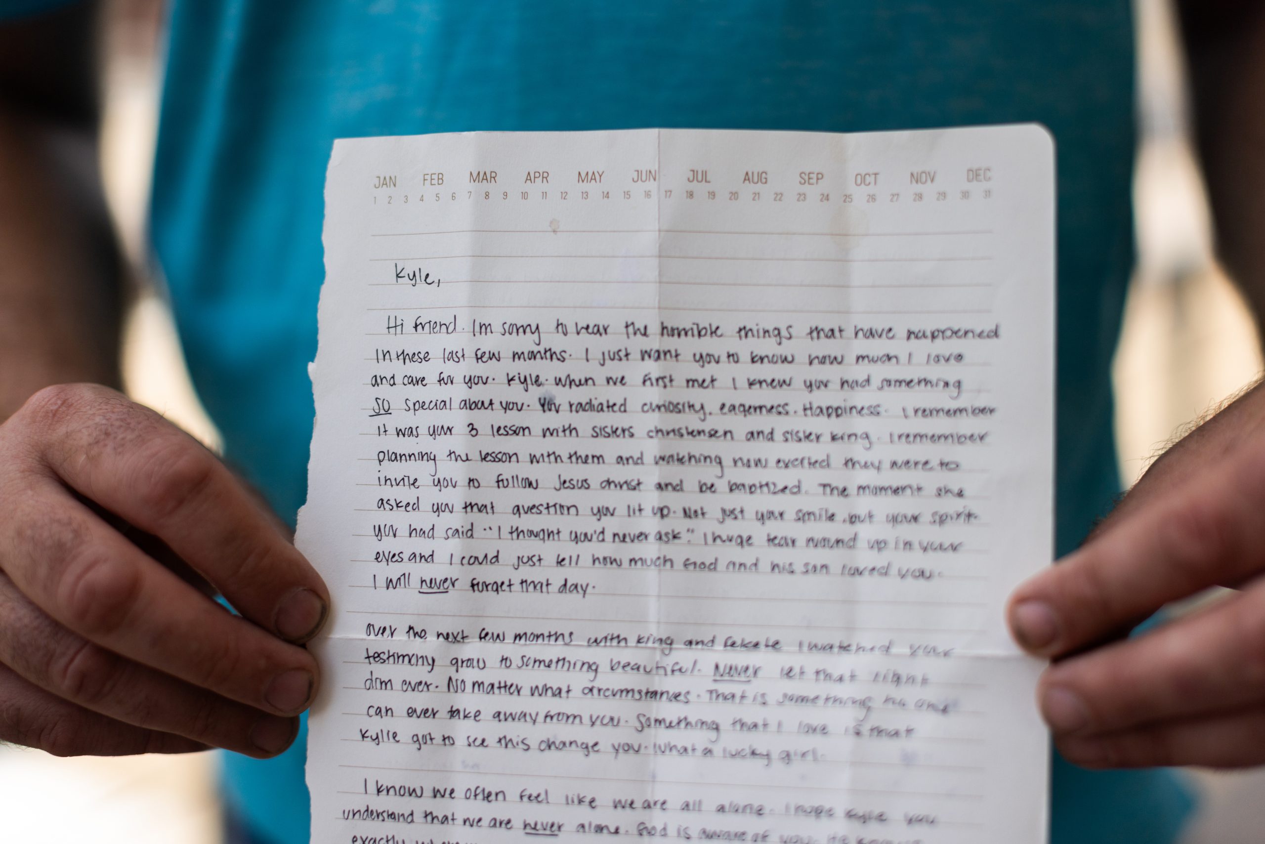 Man holds a hand written letter