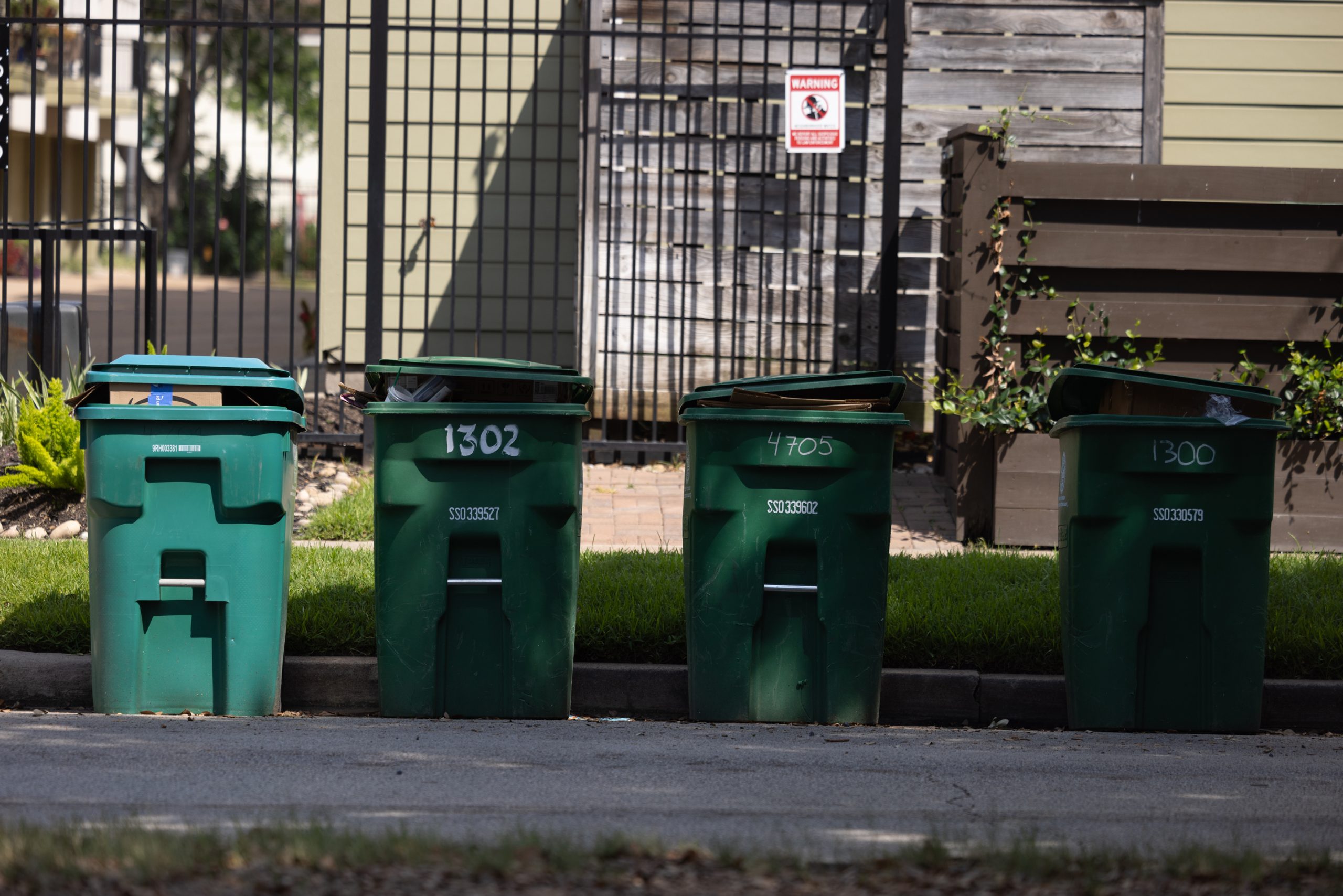 City of Houston recycling bins stand unemptied by the city’s Solid Waste Management