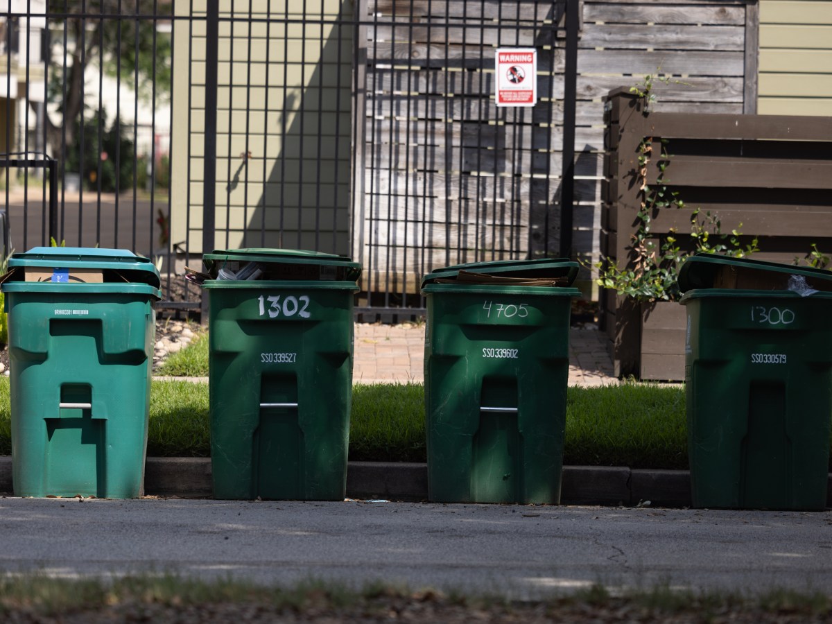 Uncollected city of Houston recycling bins