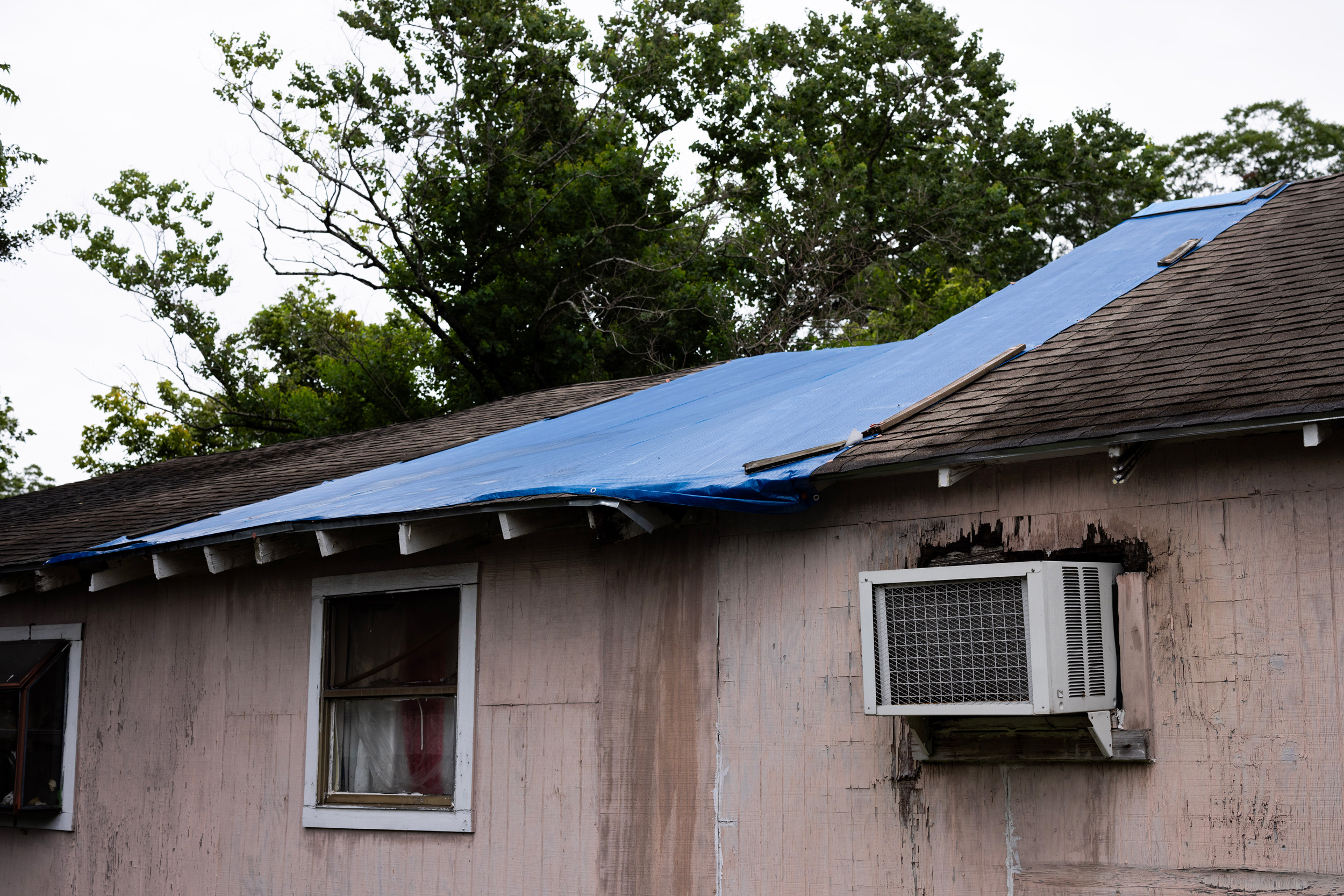 A tarp covers a section of Jessie Jacobs’s house that is leaking