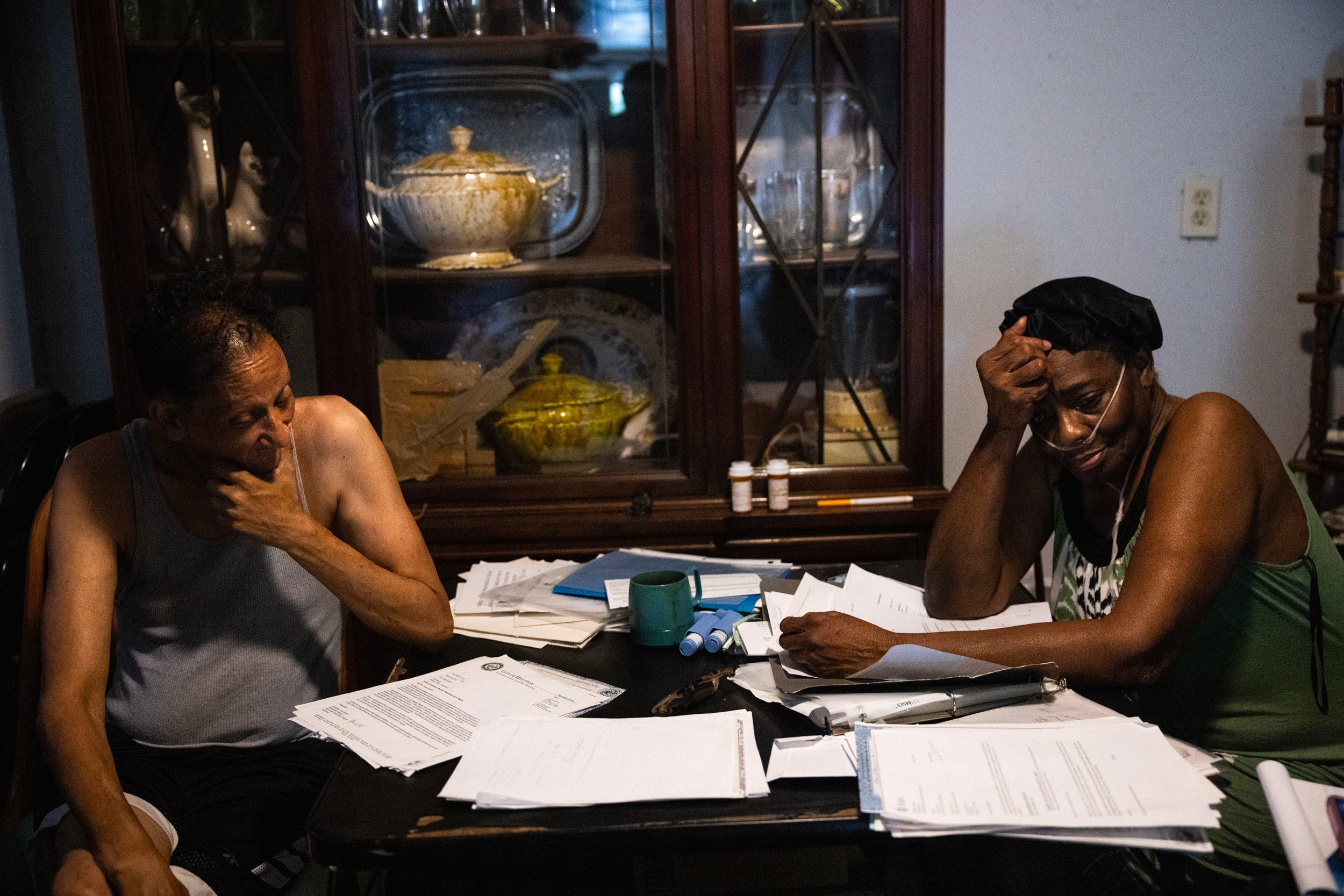 Tracey Wisher, at left, and his sister Jessie Jacobs speak about Jacobs’s damaged home