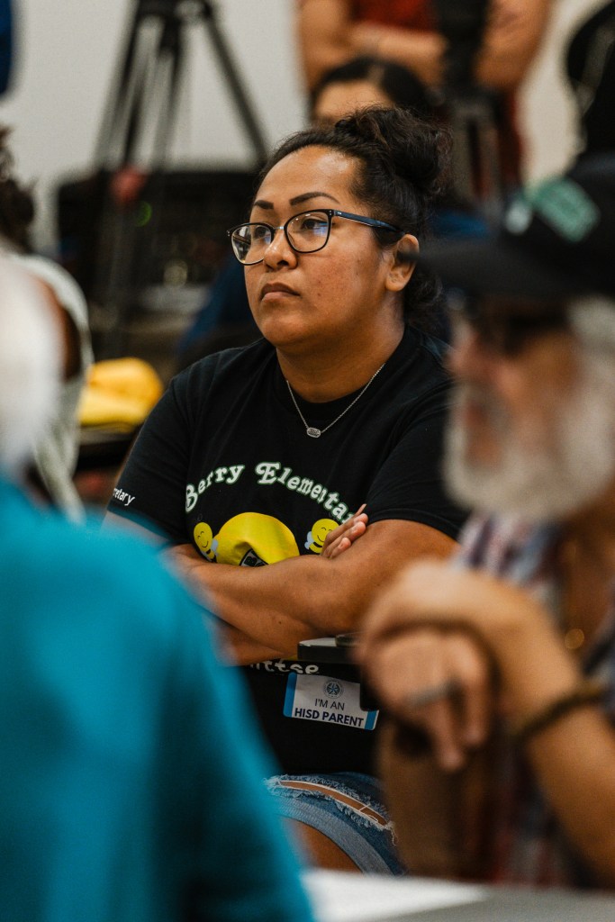 Maribel Ramirez listens to Houston ISD Superintendent Mike Miles during a community meeting