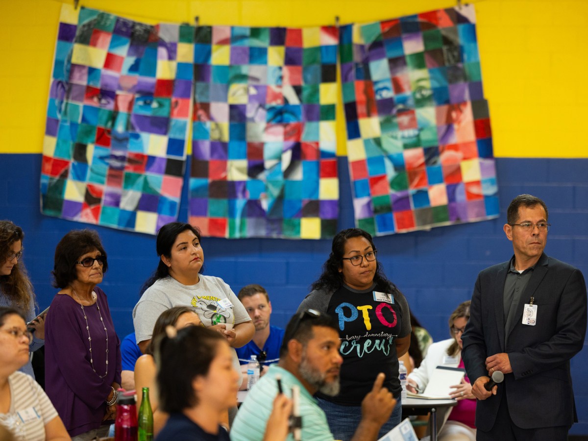 Parents of HISD students wait in line to share concerns with the HISD superintendent Mike Miles during an HISD Family Engagement event at Marshall Middle School, Thursday, July 13, 2023, in Houston.