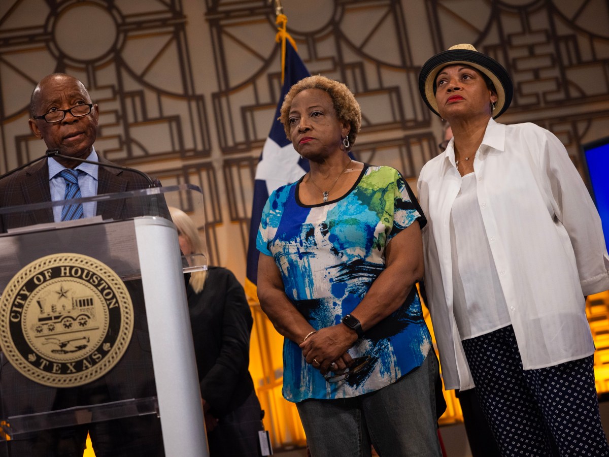 Mayor Sylvester Turner gives opening remarks Thursday while accompanied by Fifth Ward residents Joetta Stevenson, at center, and Pamela Matthews, at right