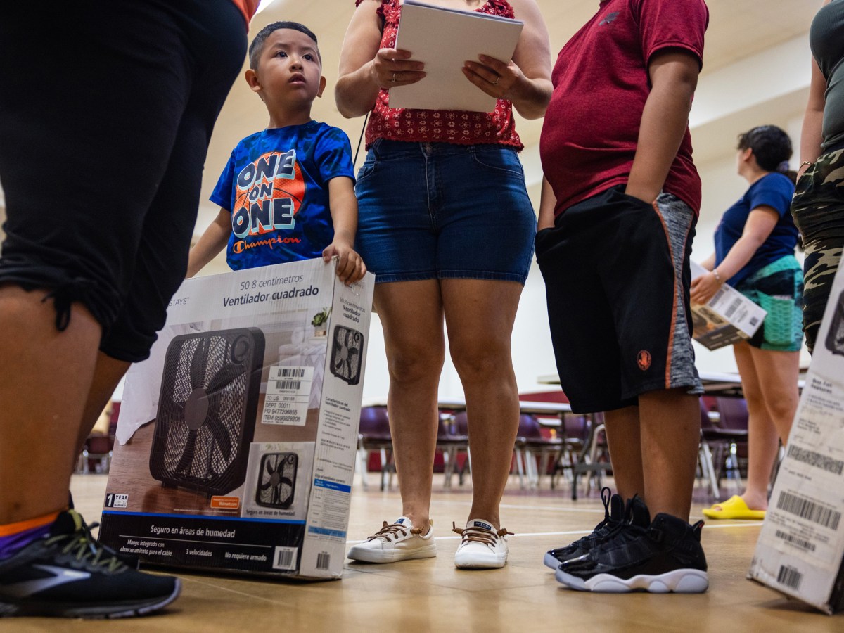 David Ramos, 5, holds a fan donated to his family