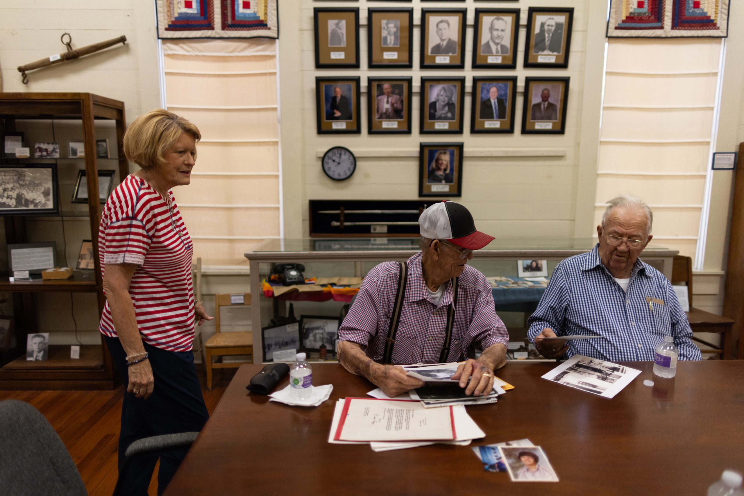 John Ripkowski, 93, and his brother Mike Ripkowski, 91, look at photos of their family