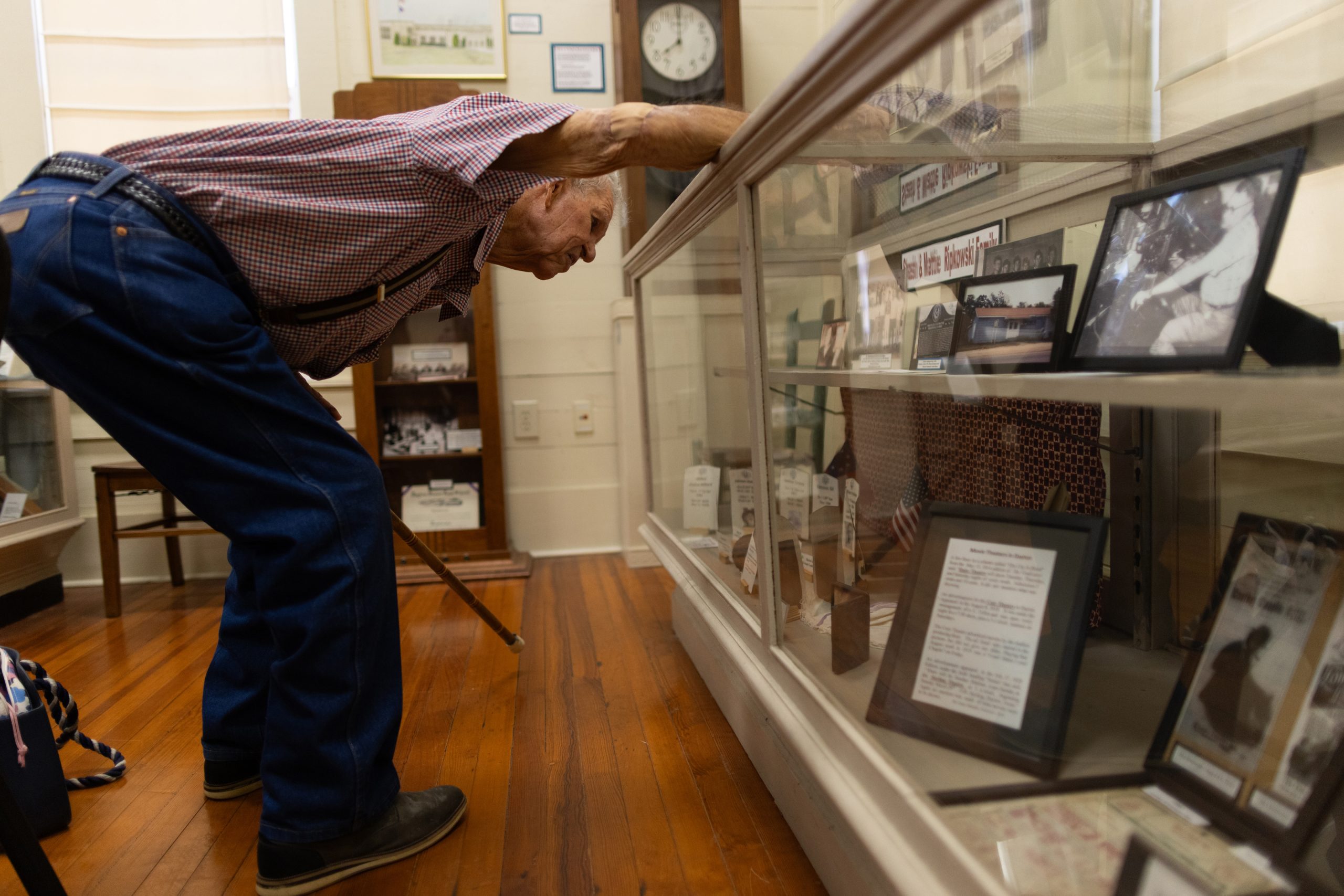John Ripkowski, 93, observes photographs of his family displayed in the Old School Museum in Dayton