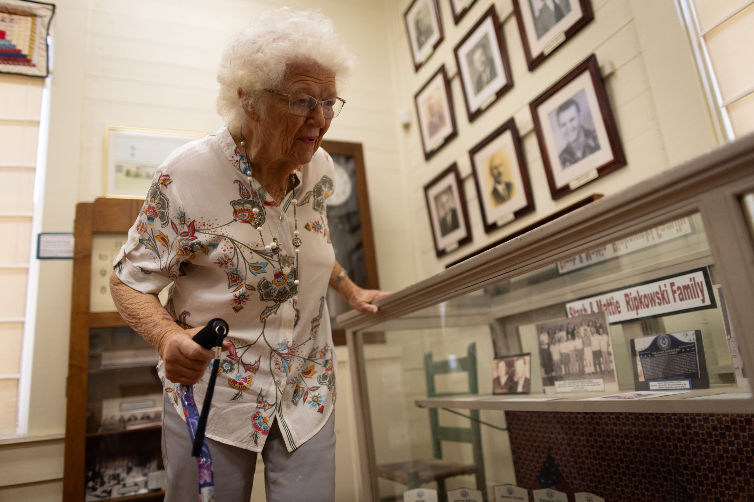 Anna Lee Campbell, 90, looks at photographs of her family displayed in the Old School Museum in Dayton