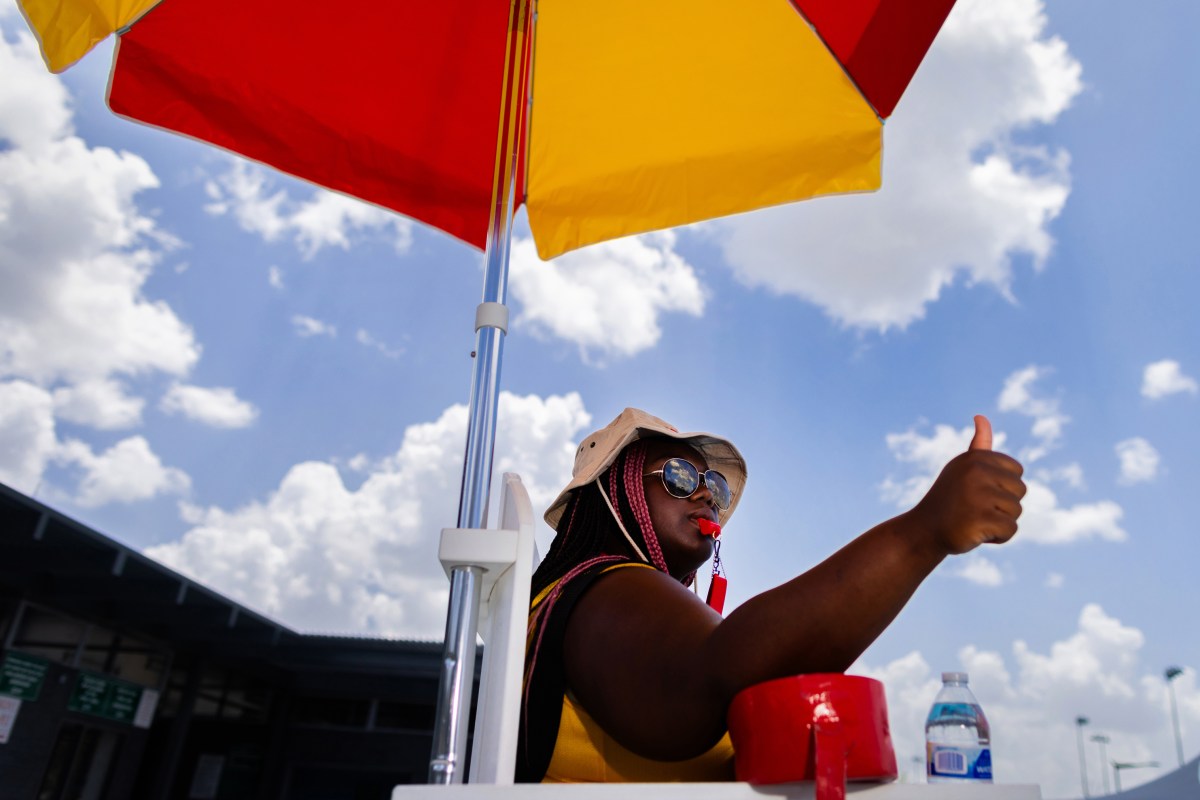 Alief Neighborhood Center and Park lifeguard Déjai Jones, 17, directs pool traffic