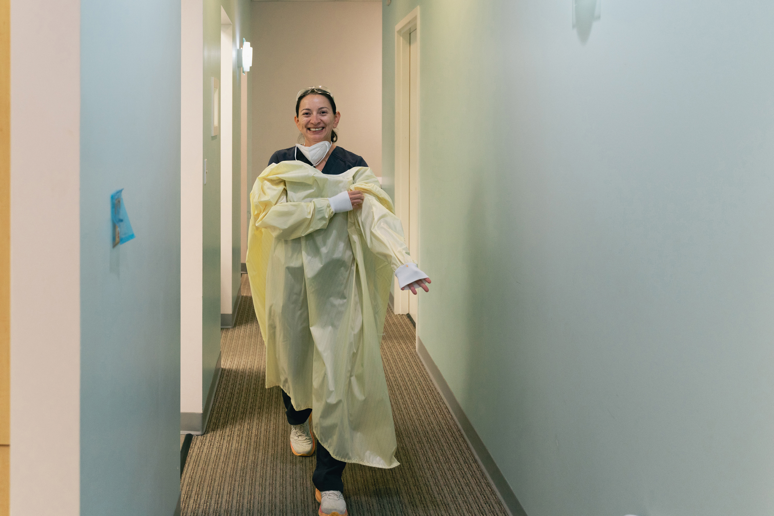 Dr. Grace Rodriguez puts on her gown