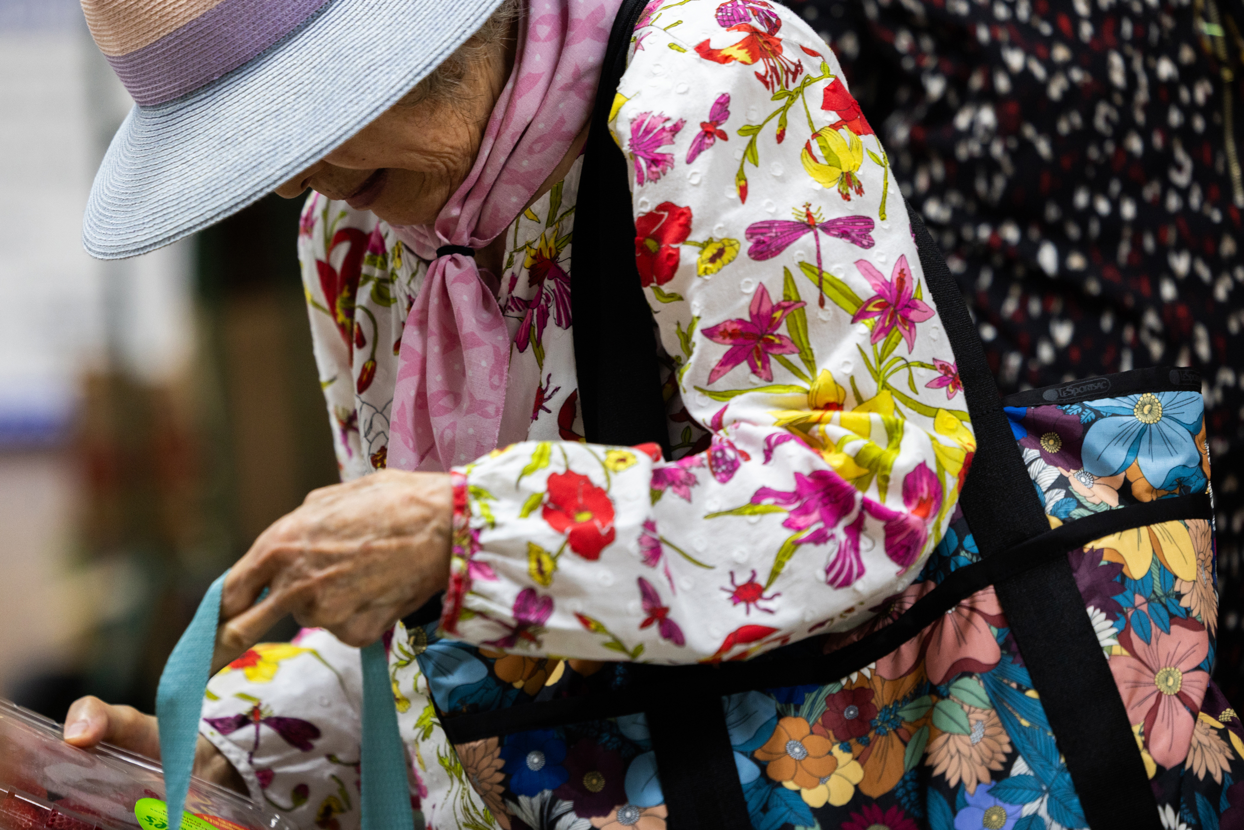 A community member picks up donated edible food at the Korean Community Center of Houston