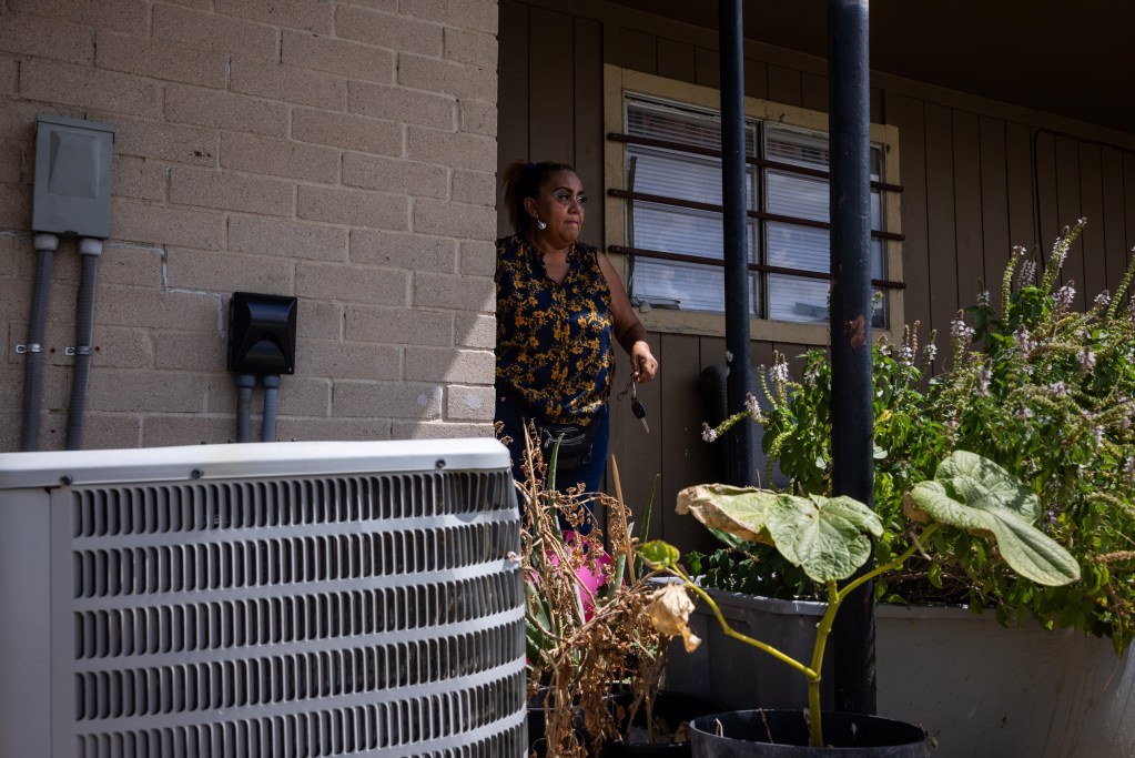 Beatriz Meraz Vargaz locks her apartment door