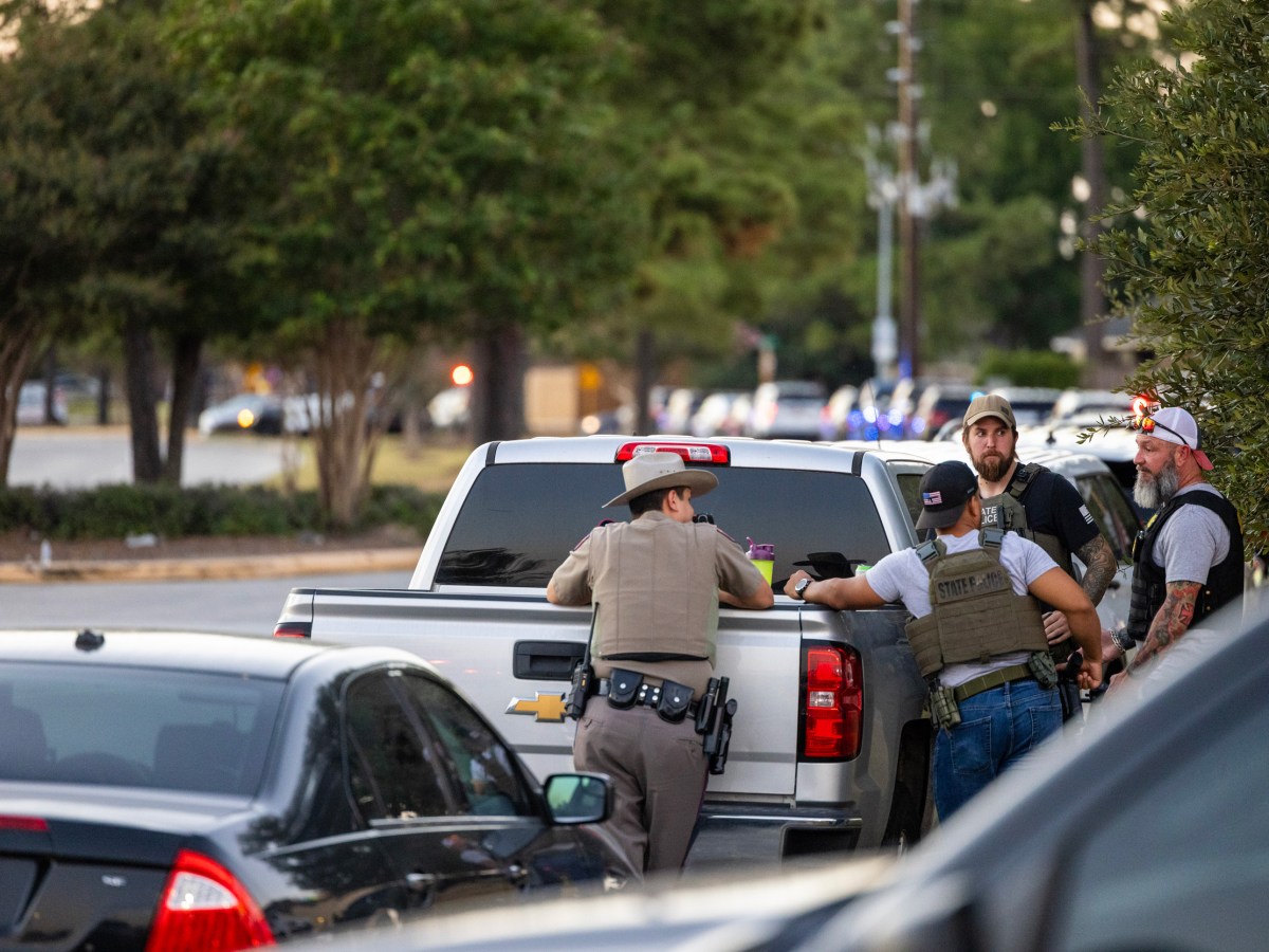 Law enforcement authorities respond to the reported shooting of two police officers in Harris County