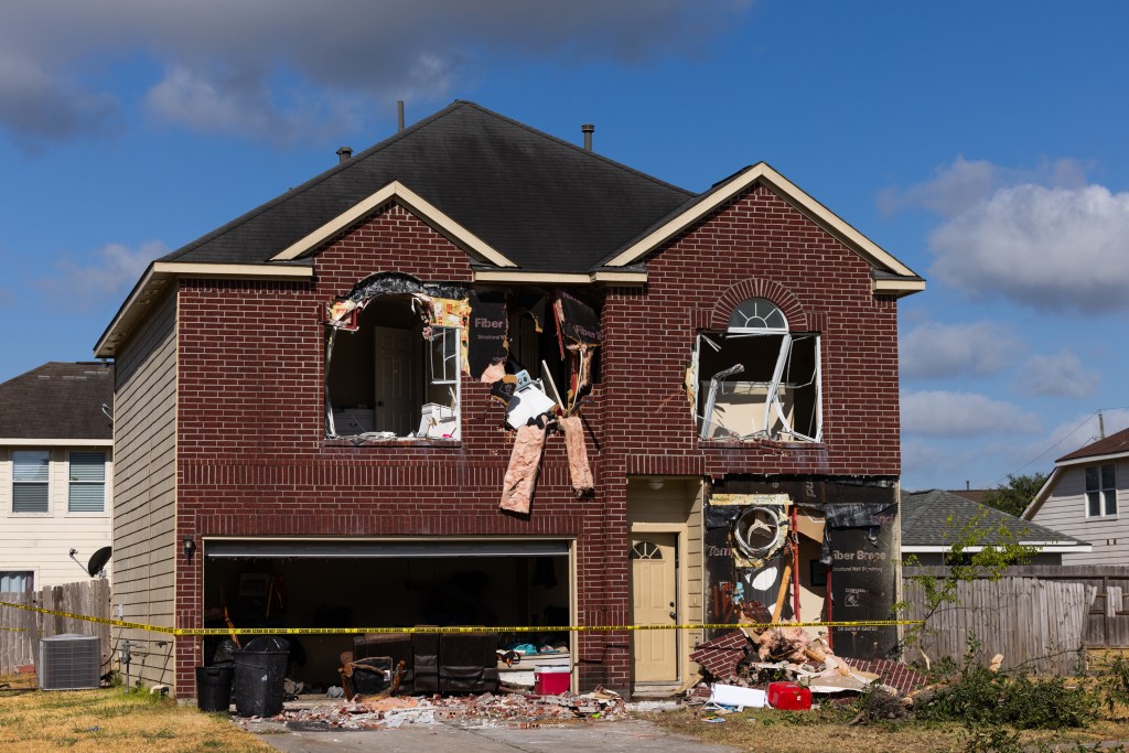 Police used heavy equipment to demolish part of a house in northeast Harris County where Terran Green, the wanted suspect accused of shooting three police officers over a 24-hour period, was barricaded Thursday.