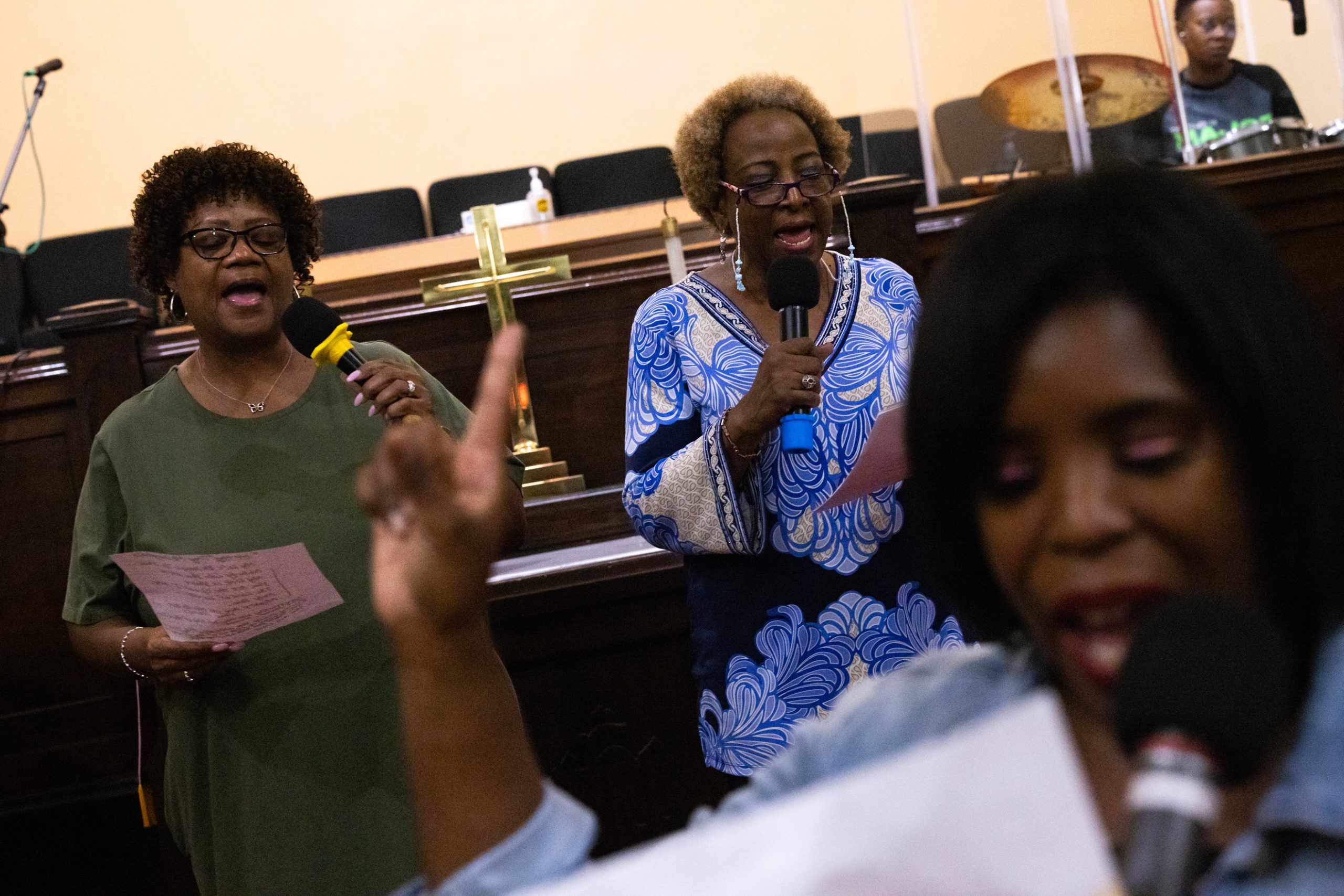 Holly Bennett, at left, and Joetta Stevenson practice songs during a choir practice 