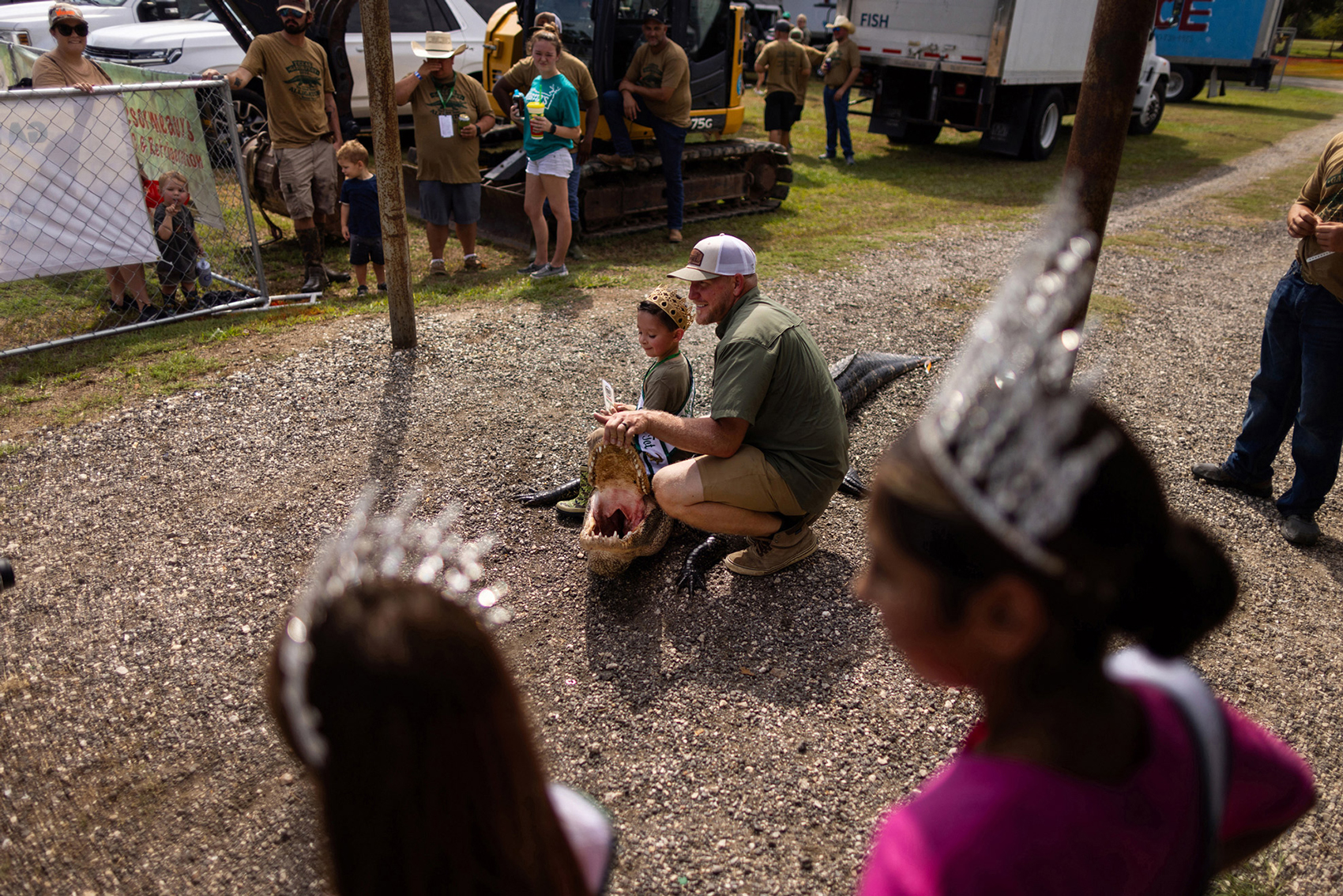 2023 Mr. Gatorfest Tot Myles Colt is placed by a hunted alligator for photographs as part of the Texas Gatorfest activities annually, Saturday, Sept. 16, 2023, in Anahuac.