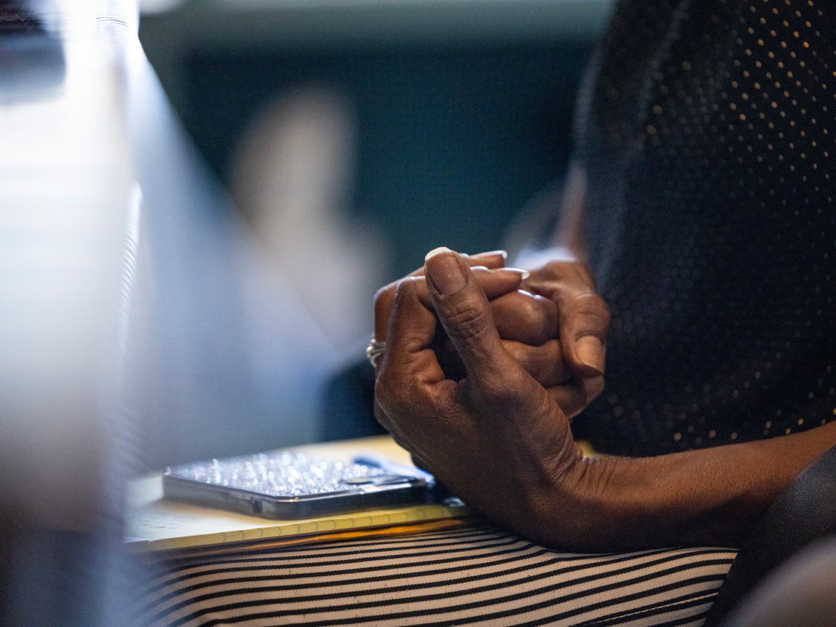 Tanisha Moore clasps her hand together as she speaks about her late son Dexter Ceasar during an interview about his death in Houston.