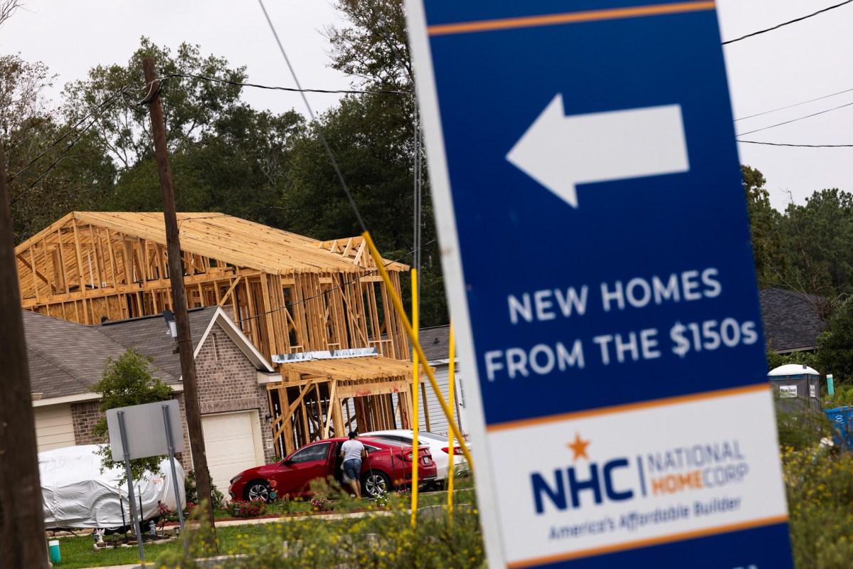 A sign advertises new homes for sale in the Santa Fe subdivision within the Colony Ridge development which has undergone significant growth over the last 10 years in Liberty County. The development has recently drawn a spotlight from conservative media who say the area is a hotbed for cartel activity, which local officials dispute.