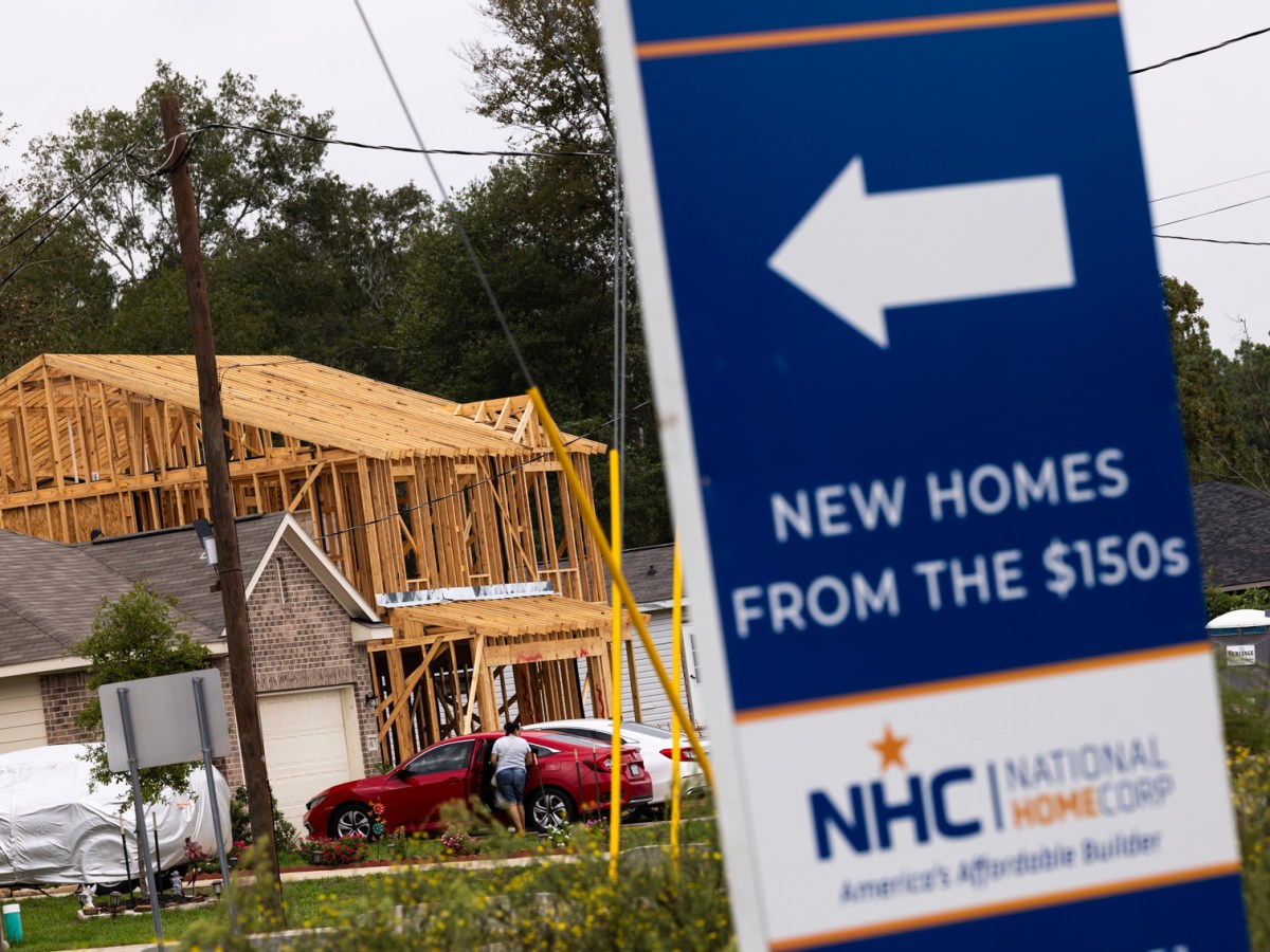 A sign advertises new homes for sale in the Santa Fe subdivision within the Colony Ridge development which has undergone significant growth over the last 10 years in Liberty County. The development has recently drawn a spotlight from conservative media who say the area is a hotbed for cartel activity, which local officials dispute.