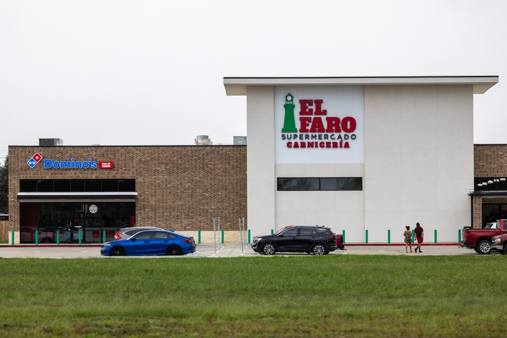 A Domino's and a supermarket on one of the major streets in the Colony Ridge development. 