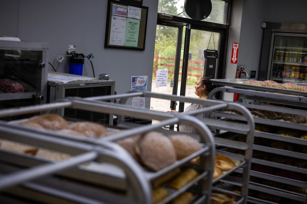 A woman exits Lajita Bakery in Colony Ridge, which is experiencing unprecedented growth for rural Liberty County. 