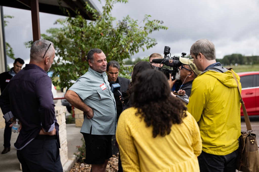 William “Trey” Harris, founder of Colony Ridge, speaks with media after a tour that took Texas lawmakers and staff around the development.