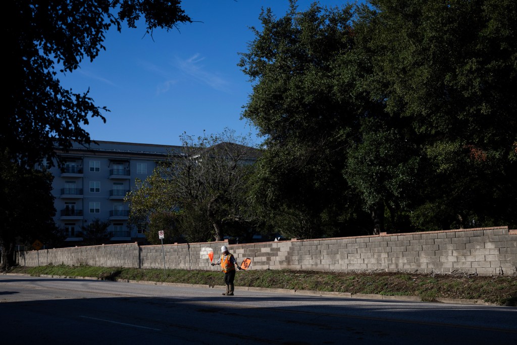 A construction worker guides a cement truck out of the soon to come Ismail Center Houston on Montrose Boulevard near Allen Parkway