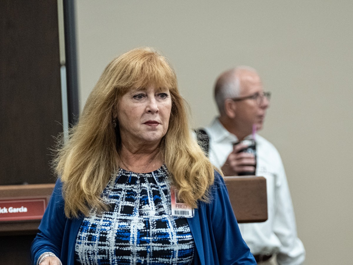 Fort Bend ISD Superintendent Christie Whitbeck makes her way through a board meeting Thursday at the district's headquarters in Sugar Land.