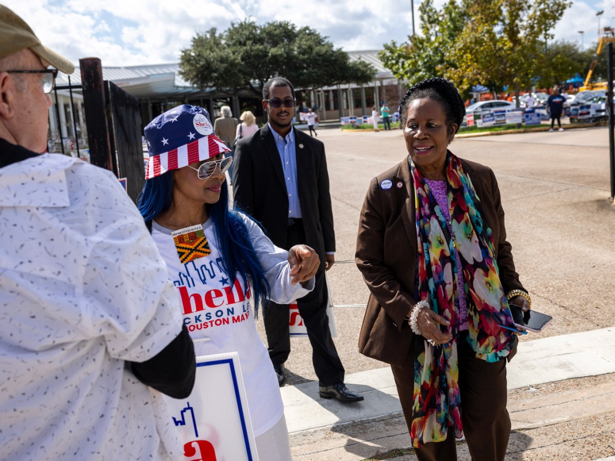Houston mayoral candidate U.S. Rep. Sheila Jackson Lee speaks with campaign volunteers outside the Metropolitan Multi-Service Center as early voting gets underway, Monday, Oct. 23, 2023, in Houston.