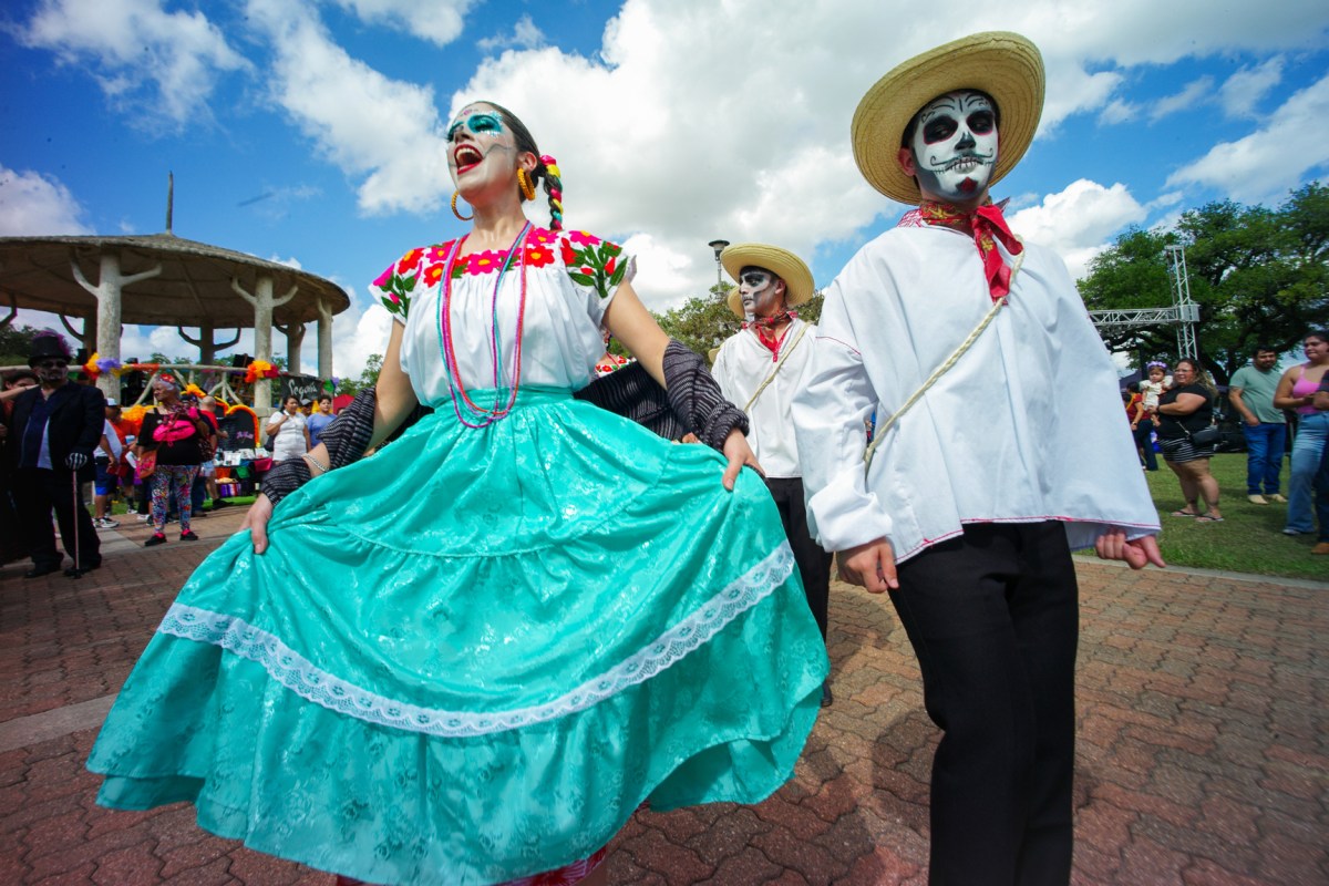 Members of Ballet Folklorico Herencia Mexicana de Houston perform for residents attending the Dia de los Muertos festival at Hidalgo Park in Houston.