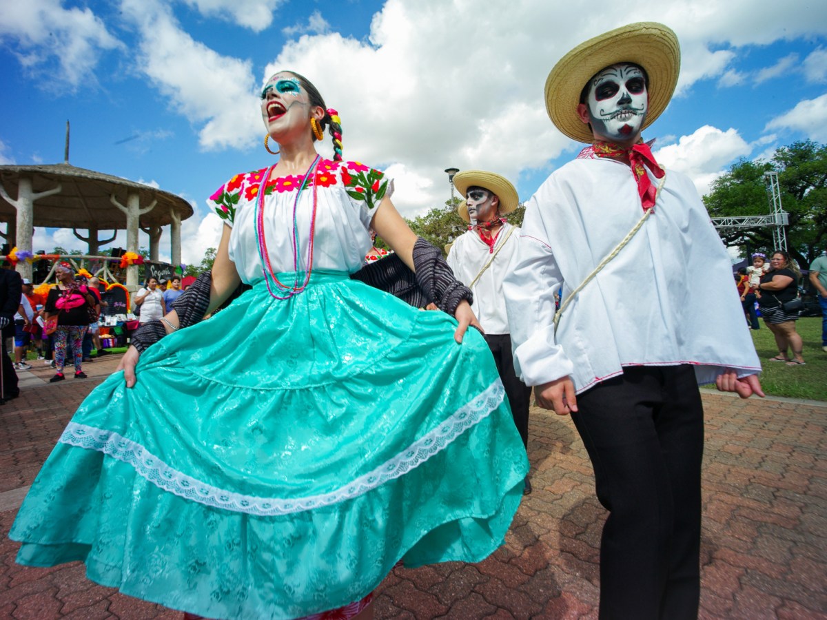 Members of Ballet Folklorico Herencia Mexicana de Houston perform for residents attending the Dia de los Muertos festival at Hidalgo Park in Houston.