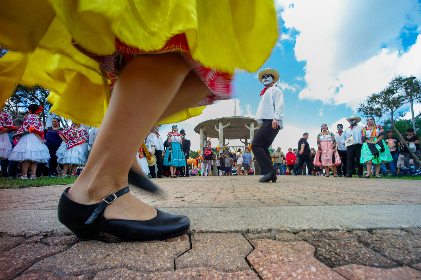 Members of Ballet Folklorico Herencia Mexicana de Houston perform for residents attending the Dia de los Muertos festival at Hidalgo Park
