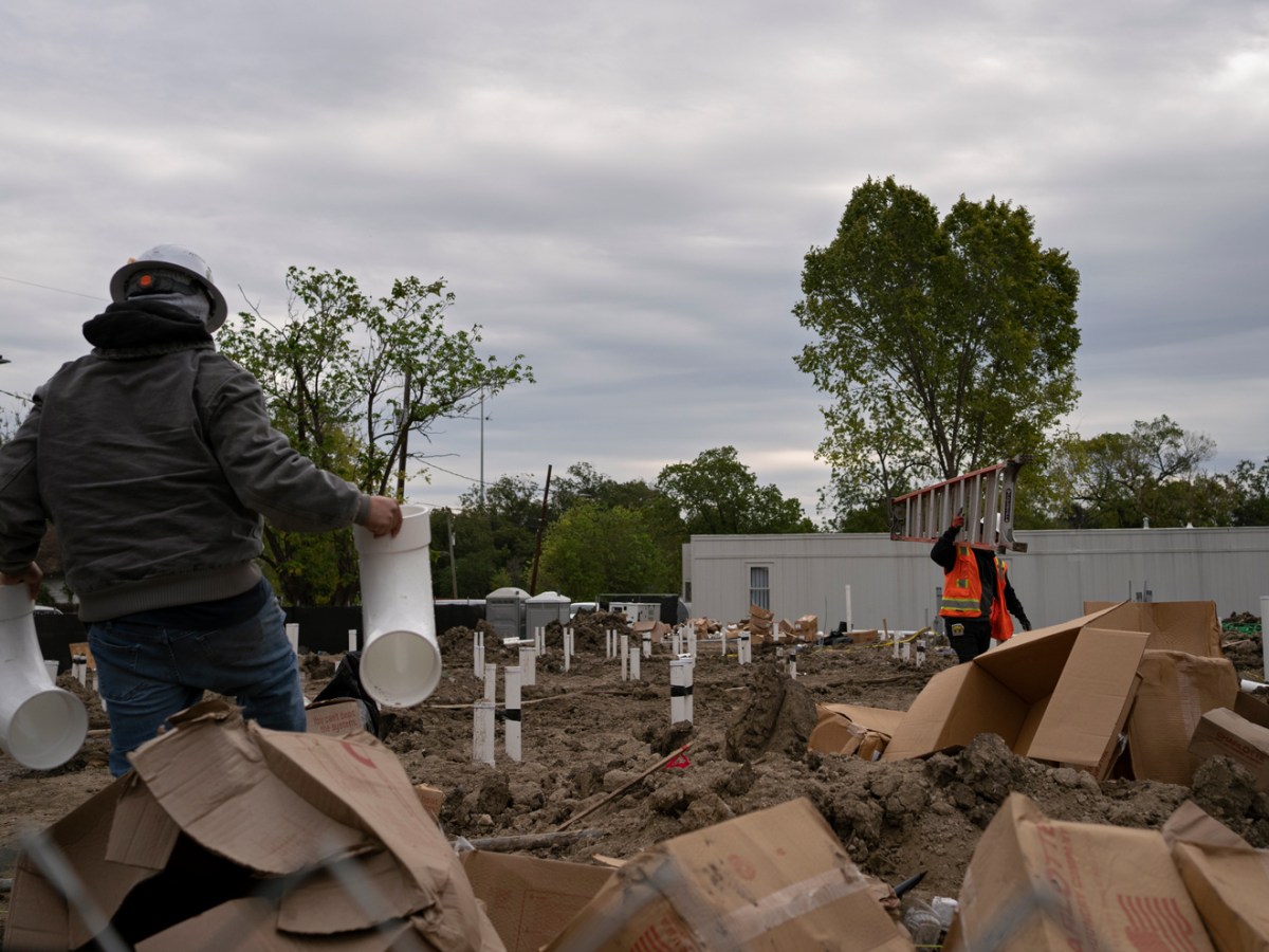 On October 31, 2023, people work on a construction site on a previously-owned Midtown Redevelopment Authority lot in a Third Ward neighborhood in Houston, Texas.