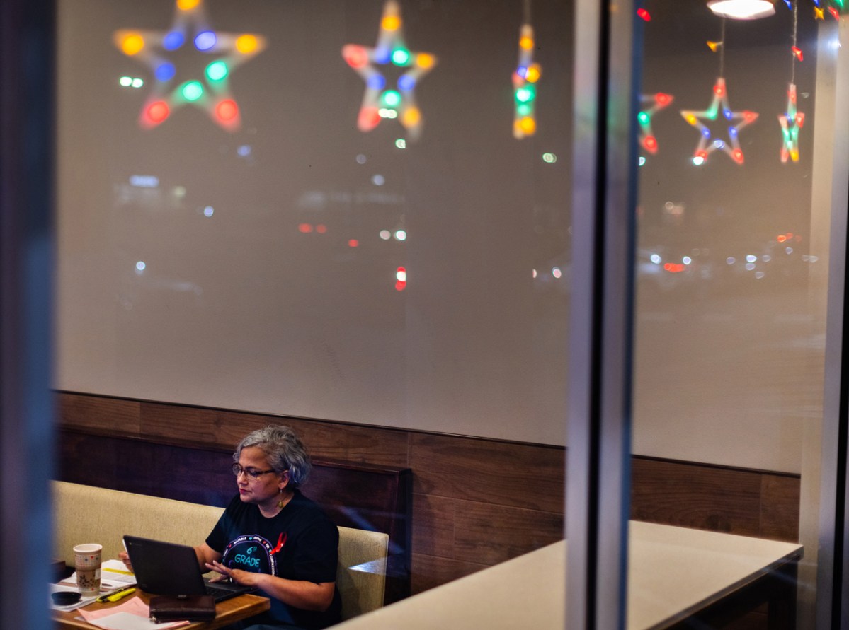 Meyerland Performing and Visual Arts Middle School social studies sixth grade teacher Tonya Sampson works remotely in the evening at the Teahouse, Thursday, Nov. 16, 2023, in Houston. (